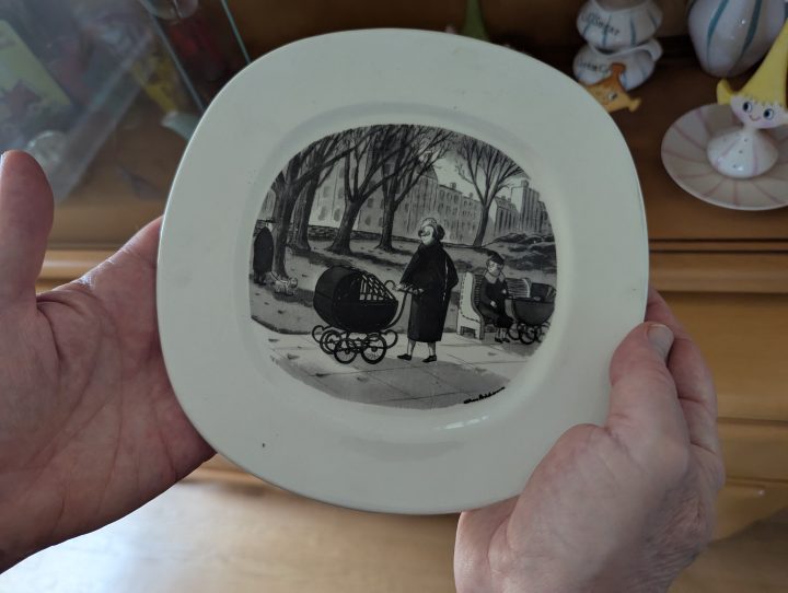 A plate featuring art by Charles Addams