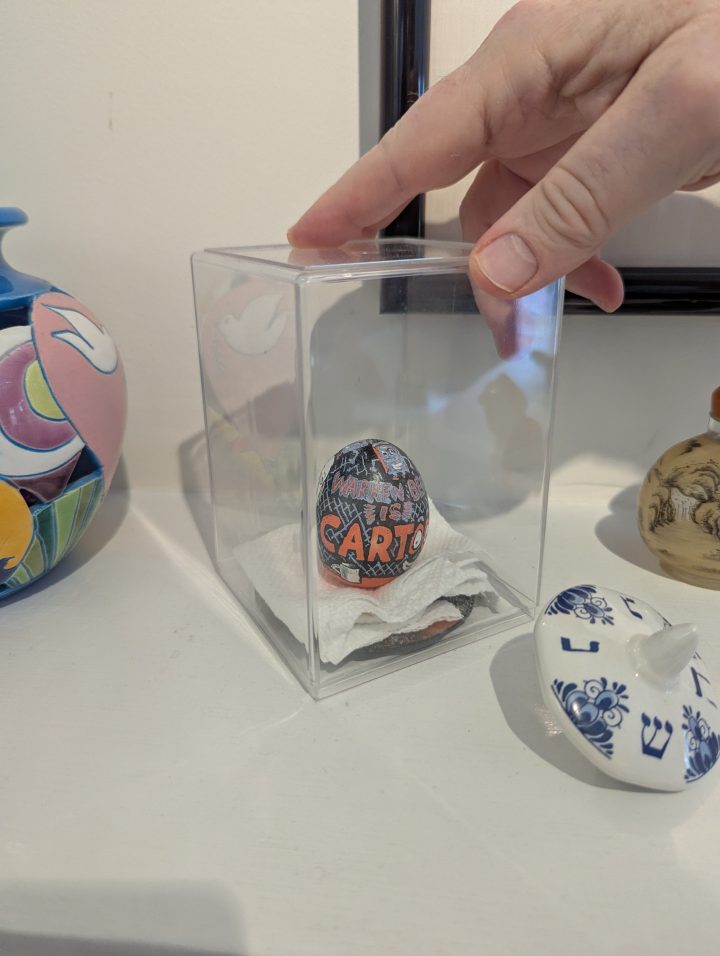 A hand painted egg by Roz Chast, a gift from the artist